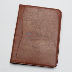 Brown calculator notebook with zip