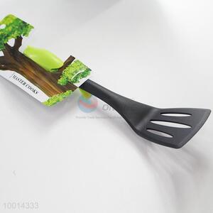 Small kitchen slotted shovel/kitchen turner with bird-shaped handle