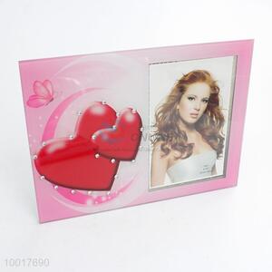 Pink photo frame with loving heart pattern