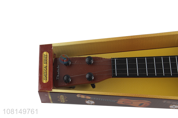 Low price 4 strings children toy ukulele mini guitar wholesale