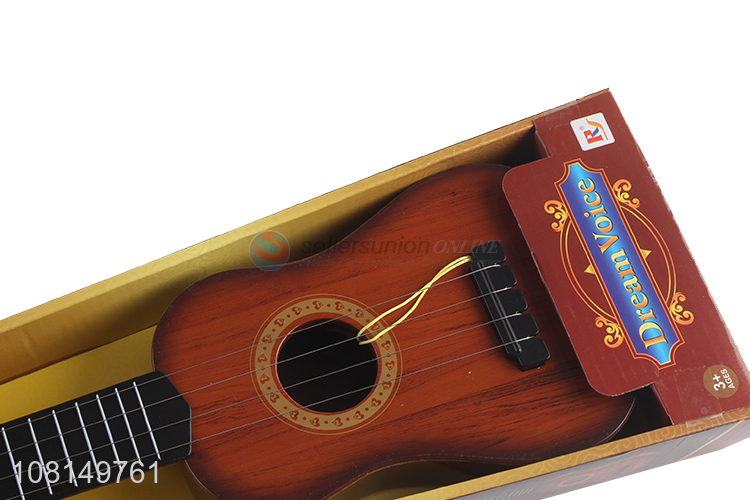 Low price 4 strings children toy ukulele mini guitar wholesale