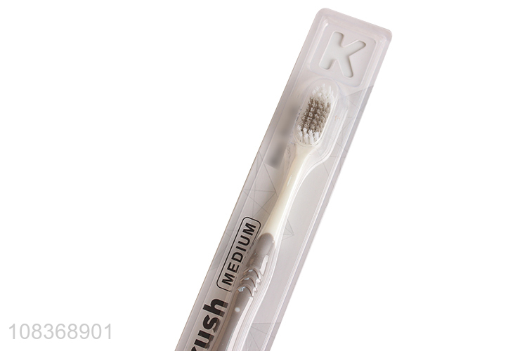 Hot sale medium bristle toothbrush with anti-slip plastic handle