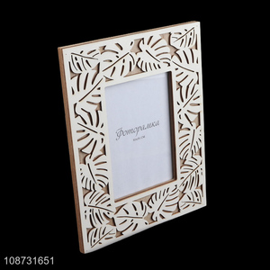 Wholesale hollowed-out engraved wooden standing photo frame for home decoration