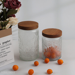 Wholesale clear flower embossed glass storage jar with airtight wooden lid
