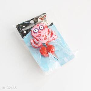 Red octopus shaped <em>toothbrush</em> <em>holder</em>