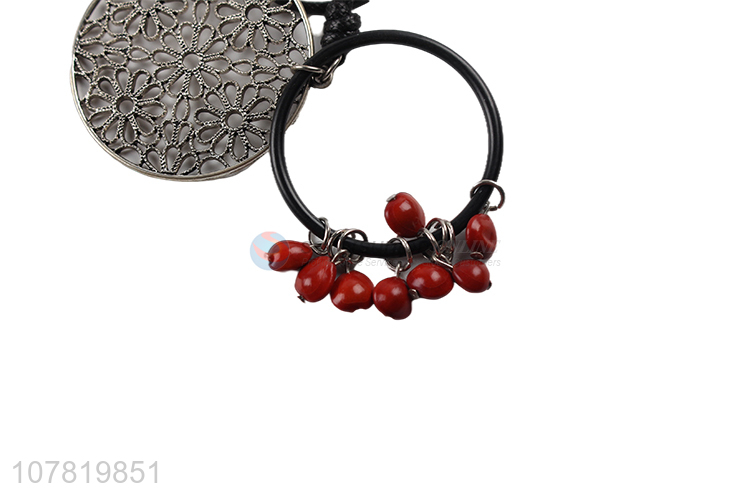 China manufacturer vintage round hollow pendant necklace with red beads