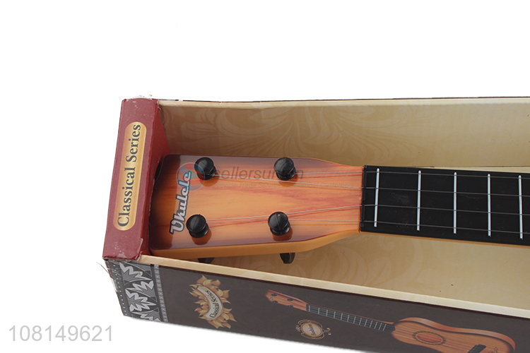 Low price 4 strings kids ukulele guitar toy musical instrument